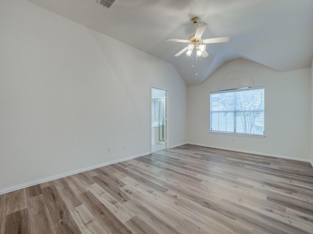 unfurnished room featuring vaulted ceiling, ceiling fan, and light hardwood / wood-style flooring