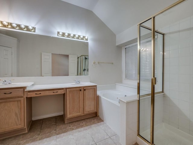 bathroom featuring tile patterned floors, lofted ceiling, independent shower and bath, and vanity