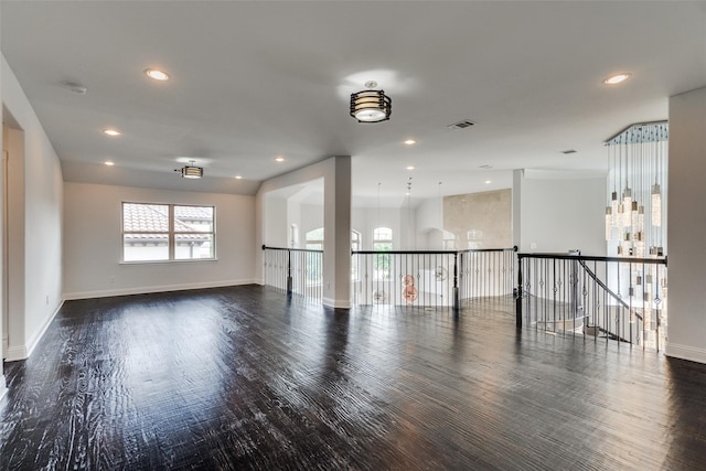 unfurnished room featuring dark hardwood / wood-style floors