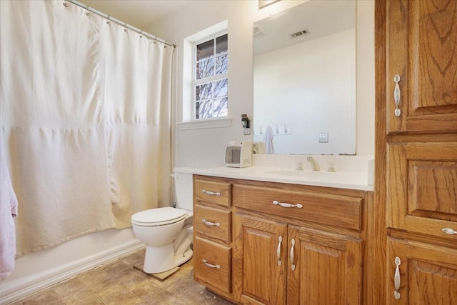 full bathroom with vanity, shower / bathtub combination with curtain, and toilet