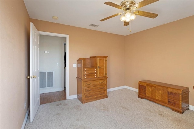 bedroom with light carpet and ceiling fan