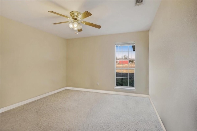 unfurnished room with ceiling fan and carpet flooring