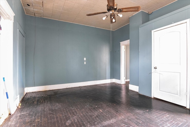 spare room featuring ceiling fan and hardwood / wood-style floors