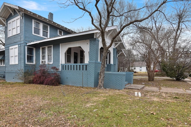 view of property exterior with a yard