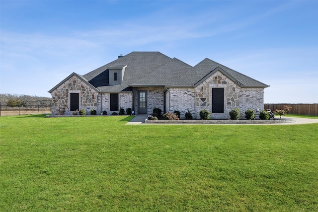 french country inspired facade with a front lawn