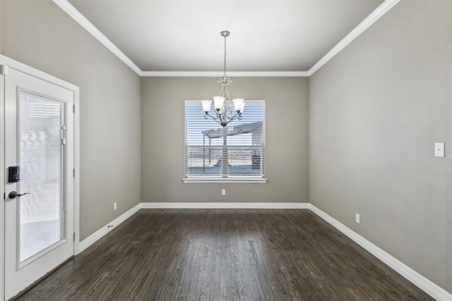 unfurnished dining area with dark hardwood / wood-style flooring, ornamental molding, and a chandelier