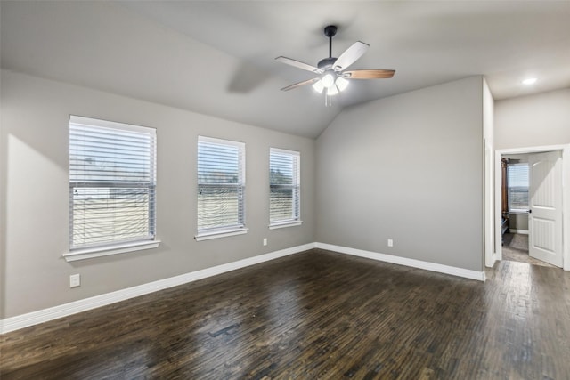 spare room featuring ceiling fan, lofted ceiling, and dark hardwood / wood-style flooring