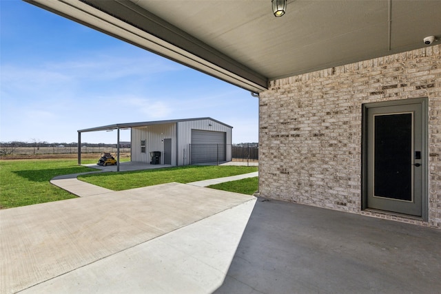 view of patio / terrace featuring a garage and an outdoor structure