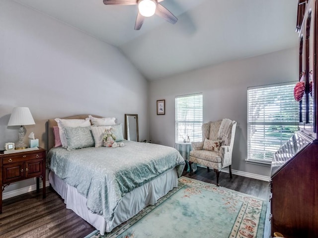 bedroom featuring ceiling fan, dark hardwood / wood-style flooring, and vaulted ceiling