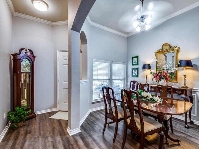 dining area featuring ornamental molding and dark hardwood / wood-style floors