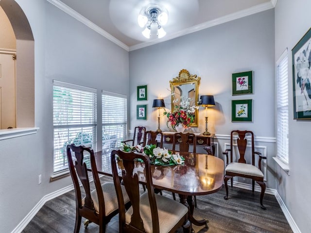 dining room with dark wood-type flooring, ceiling fan, and ornamental molding