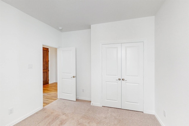5208 Greenbrook Rd, Denton, TX 76226 - unfurnished bedroom featuring light colored carpet, a closet, and baseboards