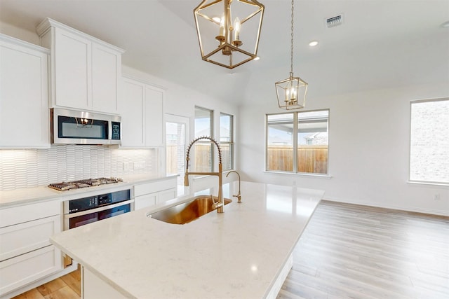 5208 Greenbrook Rd, Denton, TX 76226 - kitchen featuring a chandelier, a sink, appliances with stainless steel finishes, healthy amount of natural light, and recessed lighting