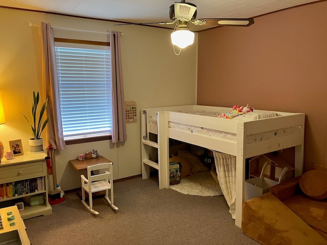 bedroom featuring dark carpet and ceiling fan