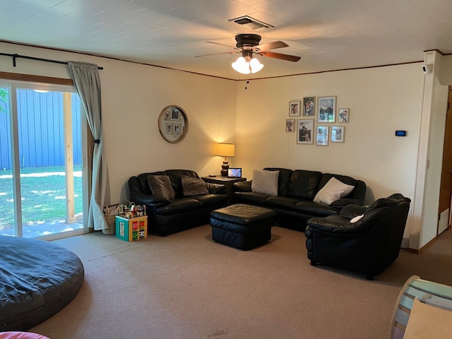 carpeted living room featuring ceiling fan