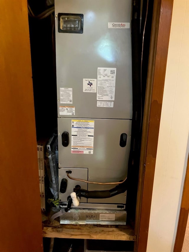 utility room with heating unit