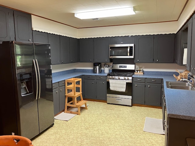 kitchen with sink and appliances with stainless steel finishes