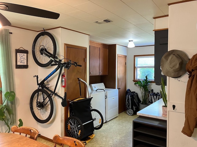 washroom with cabinets and separate washer and dryer