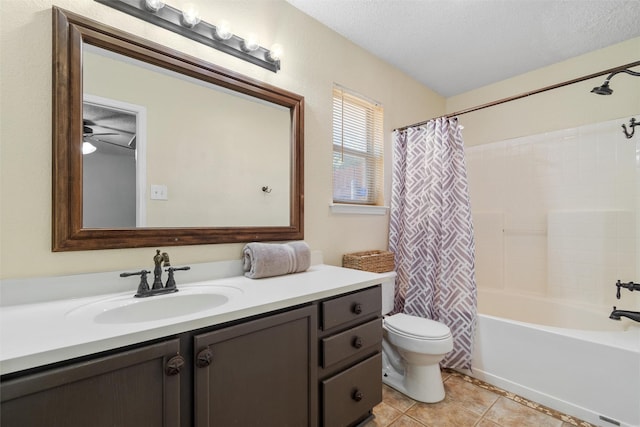 full bathroom with vanity, a textured ceiling, tile patterned floors, toilet, and shower / bath combo with shower curtain