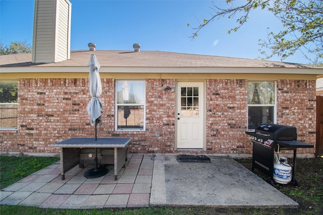 rear view of property featuring a patio