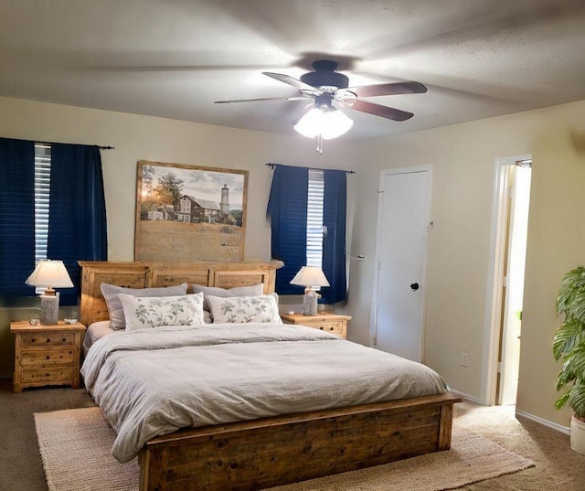 bedroom with ceiling fan and carpet floors