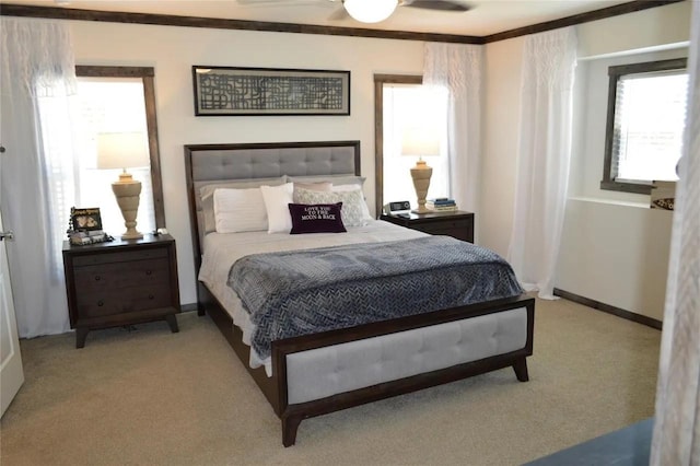 carpeted bedroom featuring multiple windows and ceiling fan