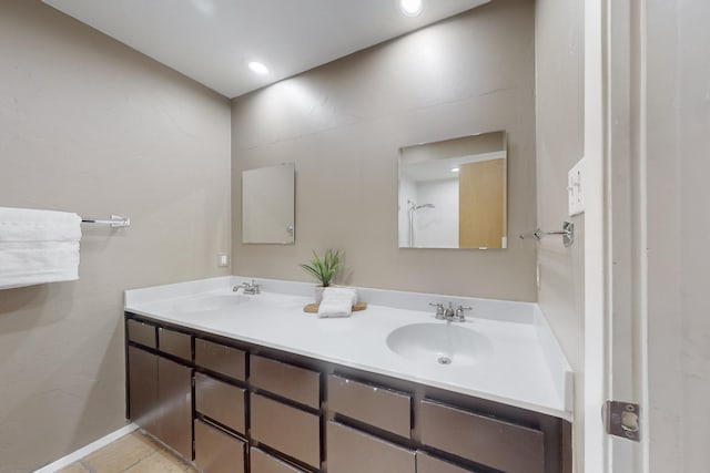 bathroom with tile patterned flooring and vanity