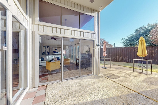 view of patio featuring ceiling fan