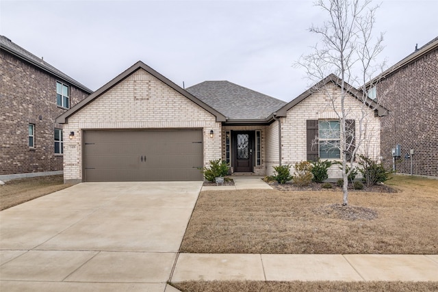 view of front facade with a garage and a front yard