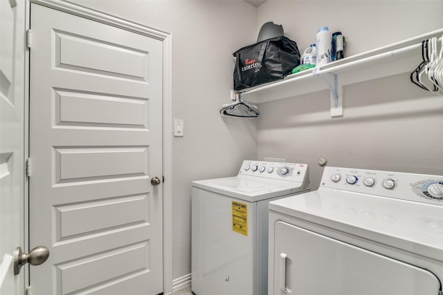 washroom with independent washer and dryer