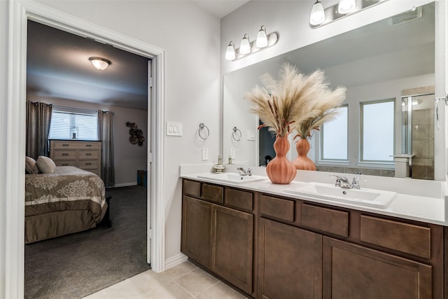 bathroom featuring tile patterned floors and vanity