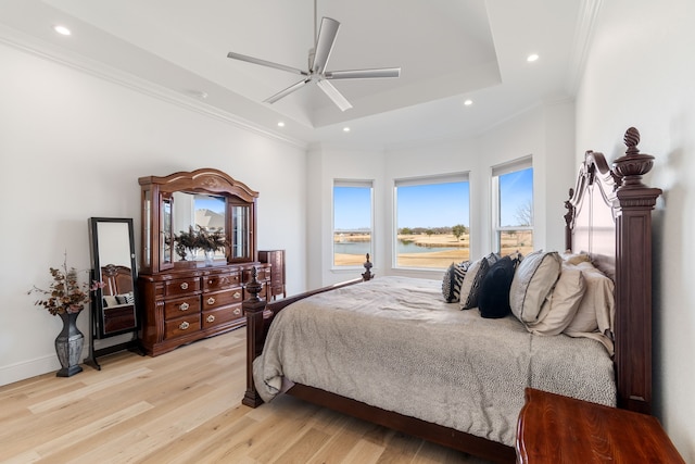 bedroom with ornamental molding, light wood finished floors, and recessed lighting
