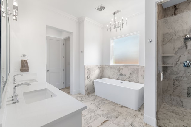 bathroom with visible vents, a marble finish shower, a sink, crown molding, and a freestanding tub