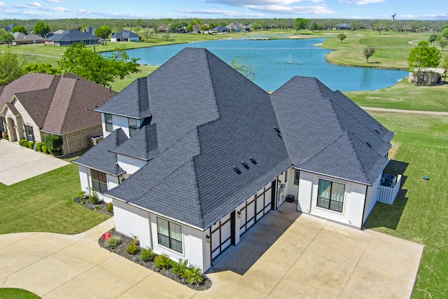 birds eye view of property with view of golf course, a water view, and a residential view