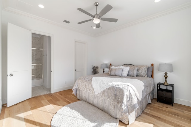 bedroom featuring ensuite bath, light hardwood / wood-style flooring, ornamental molding, and ceiling fan