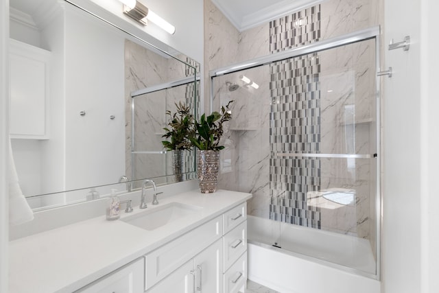 bathroom with vanity, bath / shower combo with glass door, and crown molding