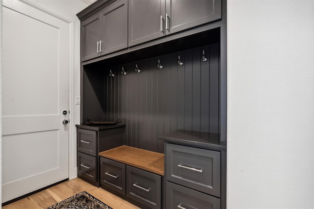 mudroom with light hardwood / wood-style flooring