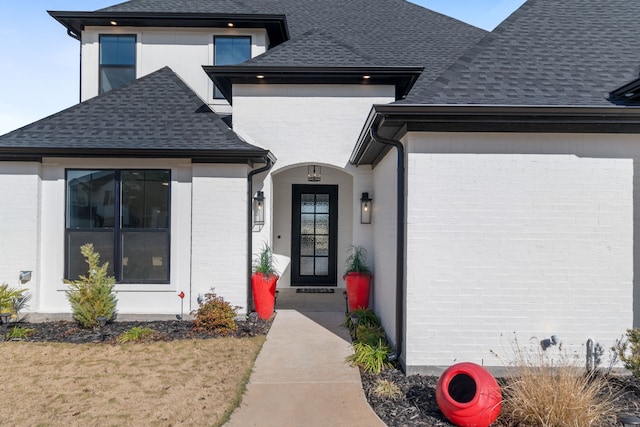 property entrance with a lawn