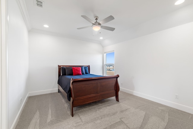 carpeted bedroom with crown molding and ceiling fan