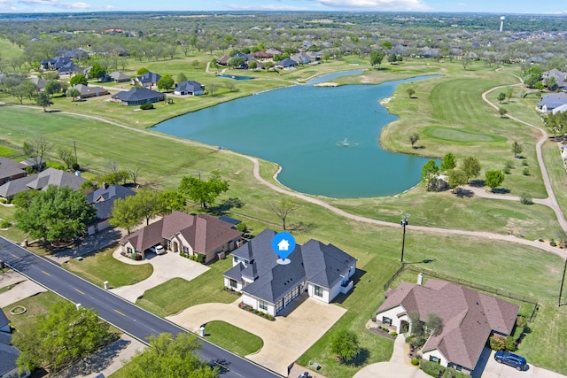 aerial view featuring a residential view, golf course view, and a water view