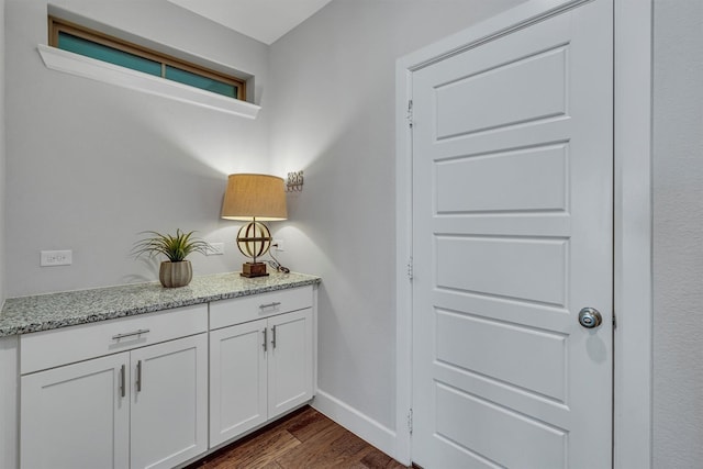 interior space featuring vanity and hardwood / wood-style floors