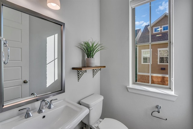 bathroom featuring sink and toilet