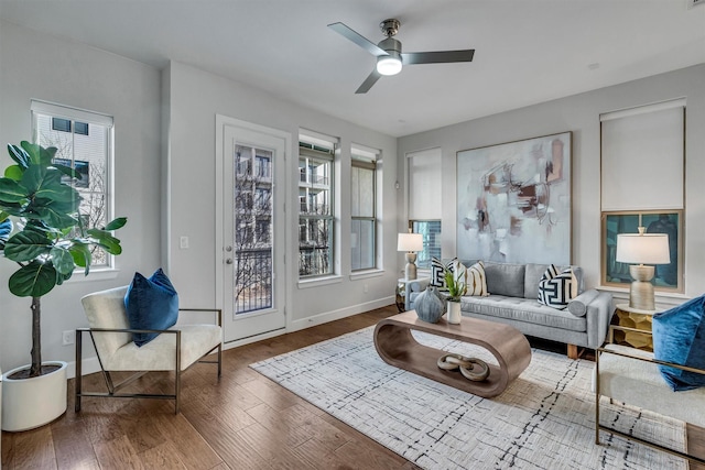 living room with hardwood / wood-style flooring, plenty of natural light, and ceiling fan