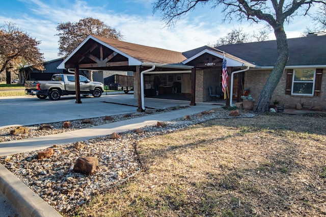 ranch-style home with a front lawn and a carport