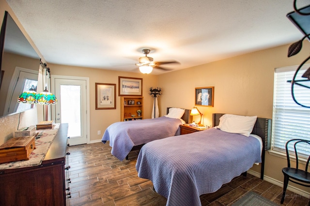 bedroom with multiple windows and ceiling fan