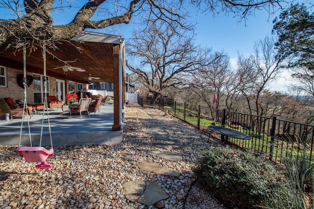 view of yard with a patio area and ceiling fan