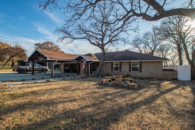 view of front of house featuring a front lawn and a carport