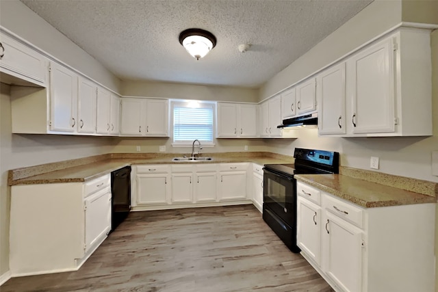 kitchen with white cabinetry, sink, a textured ceiling, and black appliances