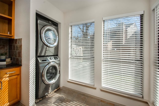 laundry room featuring stacked washing maching and dryer