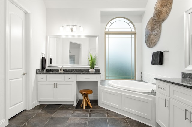 bathroom with a bathing tub and vanity